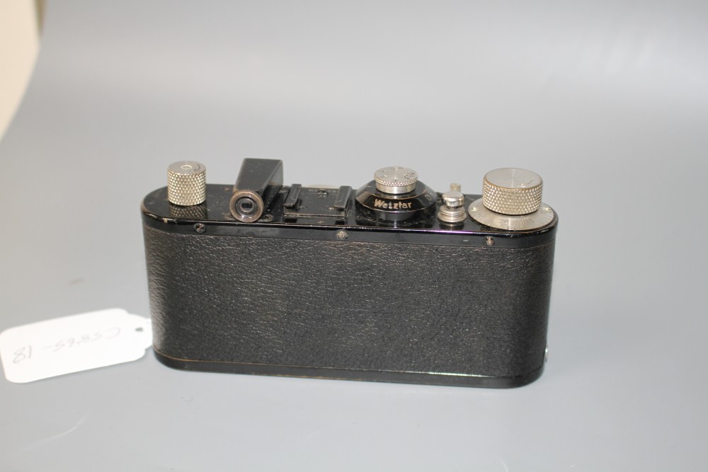 An Ernst Leitz 35mm camera, no. 150854, with Elmar 1:35 50mm lens, 13cm, height 7cm